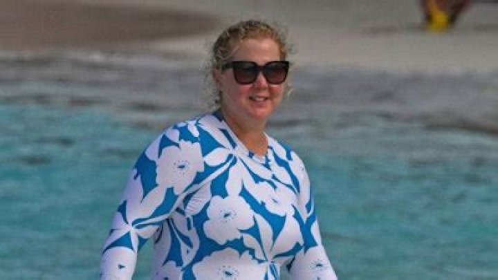 Amy Schumer makes risqué tease in beachside swimsuit photo with her husband