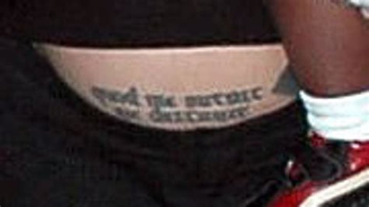 Angelina displays her baby bump tattoo