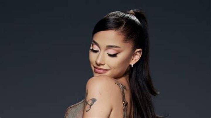 Ariana Grande spices it up in a cone bra and high slit skirt for grand return to beloved show