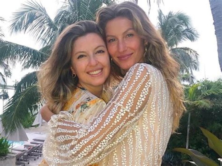 Gisele and her twin wow in bikinis as they pose poolside with their other swimsuit-clad sisters