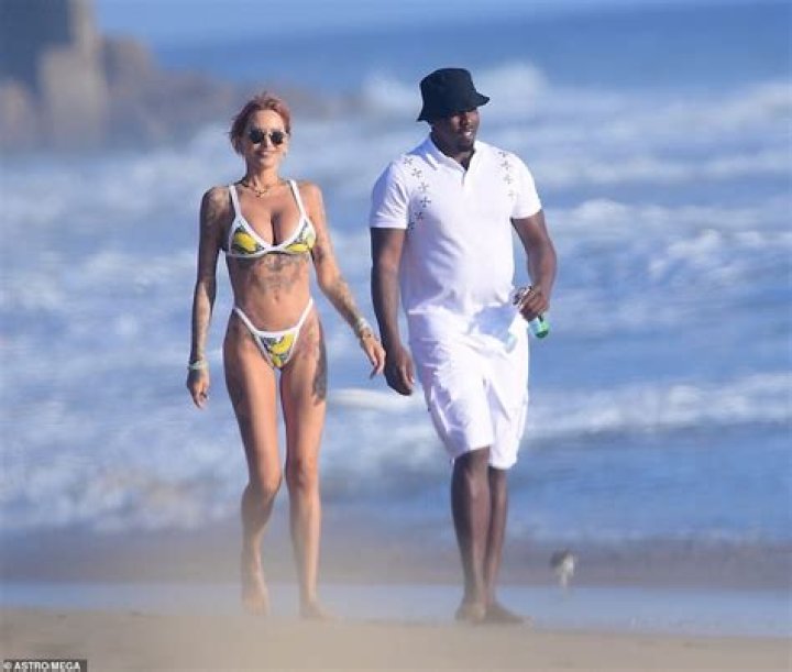 Hip-hop mogul, Diddy kisses Brian Austin Green's ex-girlfriend, Tina Louise as they pack on the PDA at the beach in Malibu (photos)