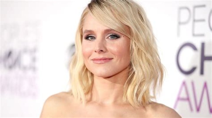 Kristen Bell turns heads in ab-baring bridesmaid mini dress