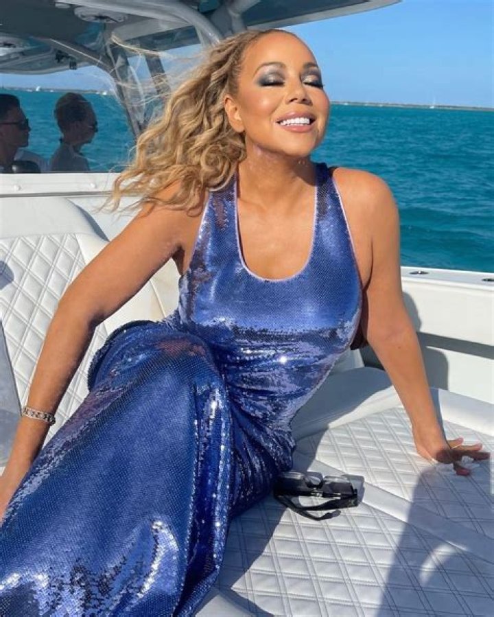 Mariah Carey dons stunning sequined figure-hugging gown for 55th birthday on the water