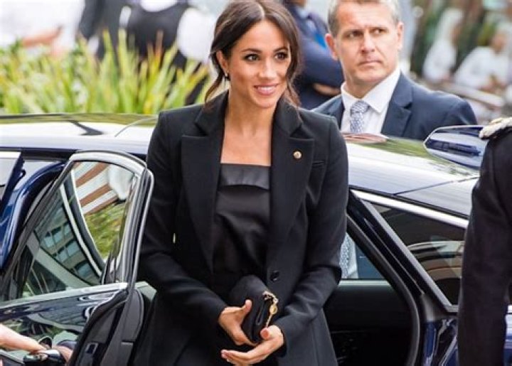 Meghan Markle is all smiles as she is pictured for the first time since release of controversial royal book Endgame